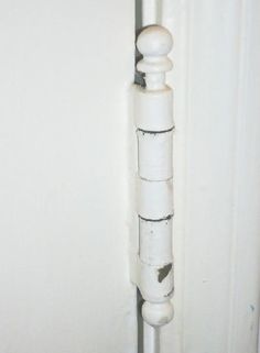 a white pipe sticking out of the side of a wall