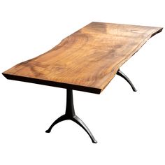 a wooden table sitting on top of a metal stand