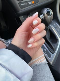 Best winter nail ideas | trendy winter nails | cute winter nails | simple winter nails | aesthetic winter nails | short winter nails Basic White Christmas Nails, Snowflake Nail Design Almond, Oval Snowflake Nails, White And Silver Holiday Nails, Shellac Nails 2024, Pale Christmas Nails, White Chrome Snowflake Nails, Sparkly White Christmas Nails, White Snowflake Nails Short