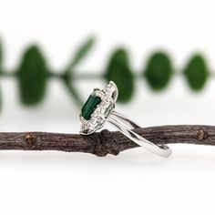 This ring features a 1.5-carat Zambian emerald with natural earth-mined diamonds, all set in solid 14K gold. This ring can be a beautiful May birthstone gift for your loved ones! This ring is made with solid 14K Gold and naturally Earth-mined SI / G-H diamonds. As listed, this ring is ready to ship. If you're interested in purchasing this setting with a different center stone please message us! Emerald Cut Emerald Ring With Halo Setting, Emerald Cut Diamond Birthstone Ring With Halo Setting, May Birthstone Ring With Emerald Cut And Halo Setting, Emerald Gemstone Cluster Ring In Emerald Cut, Emerald Ring With Halo Setting For May Birthstone, May Birthstone Emerald Ring With Halo Setting, Emerald Cluster Ring With Emerald Cut And Accent Stones, Emerald Cut Diamond Emerald Ring With Accent Stones, Emerald Cut Birthstone Ring With Halo Setting