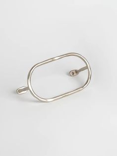 a silver ring on a white background