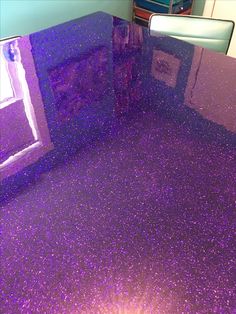 purple glitter flooring in a bathroom with blue walls