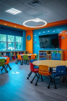 an empty classroom with colorful chairs and tables