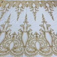 gold embroidered fabric on white background