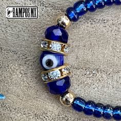 "Beautiful Mexican Handmade Woven \" Blue Evil Eye Symbol\" Kids and adults Unisex bracelet \"Mal de Ojo\" with the company of San Benito Symbol is Handmade braided Design by our Artisan Team to create a beautiful Stylish ,protection and positive accessory , definitely a must have in your religios Collection :) ( One bracelet per order) Color can change slightly depending on the device screen thats been viewed on. Bracelet has and adjustable : kids Unisex and adult :One size Fits All Unisex Braz Handmade Blue Round Crystal Bracelet, Blue Resizable Bangle Jewelry, Adjustable Hand Wrapped Evil Eye Bracelet, Handmade Blue Stretch Bracelet For Festivals, Blue Adjustable Bangle Bracelet, Adjustable Blue Beaded Wristband, Blue Spiritual Stretch Bangle Bracelet, Blue Spiritual Bangle Stretch Bracelet, Blue Adjustable Spiritual Jewelry