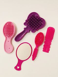 Doll Combs and Brushes  Barbie Combs Brushes and Mirrors Barbie Doll Accessories Mattel Toys Set of 5 Lot Hair Accessories Plastic Toys Variety of Doll hair accessories, 5 items included in this order. Various sizes, pink, hot pink and purple combs and brushes and 1 hand mirror. Mixed Lot Brands Vary - You received all the items pictured in photo.  Condition: Good vintage condition, pre-owned, gently played with. Please ask all questions before purchasing this item(s). International shipping ava Combs And Brushes, Life Size Barbie, Hair Accessories Pink, Accessoires Barbie, Mirror Accessories, Barbie Doll Accessories, Barbie Hair, Accessories Pink, Plastic Doll