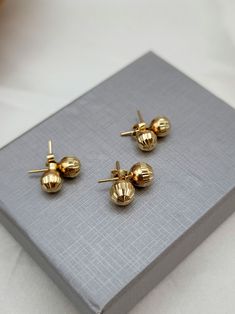 18K Gold Ball Push Back Stud Earrings. Diamond-cut! The earrings are available in 6-8mm (millimeters) wide choice! * 7mm  grams weight: 1.48 gr lengths: 18mm width: 7mm * 8mm  grams weight: 1.93 gr lengths: 18mm width: 8mm * 18k gold will not oxidize or discolor, so you can wear your jewelry every day, everywhere. ➡️ Priced to sell! Please compare our prices to other similar sellers! * I am pleased to offer complimentary shipping to all over the world. * Your order will be ready for shipment in 1-3 business days. * All my creations are carefully wrapped in an elegant case. * I take absolute care of precious jewels are packed well so that there is no damage to the product. * All items will be shipped to you with a certificate of gold purity and authenticity of Karat. ➡️ Returns: Your satisf Yellow Gold Round Beads Earrings, Yellow Gold Round Bead Earrings As Gift, Yellow Gold Earrings With Round Beads As Gift, Gold Earrings With 14k Round Beads, 14k Gold Earrings With Round Beads, Beaded Ball, Ball Stud Earrings, Yellow Gold Earrings, Ball Earrings