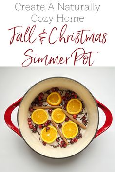 a pot filled with orange slices and cranberries