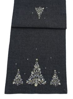 a black scarf with christmas trees on it