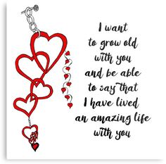 two hearts hanging from a string with the words i want to grow old with you and be able to say that i have lived an amazing life with you