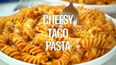 a bowl filled with cheese taco pasta on top of a table