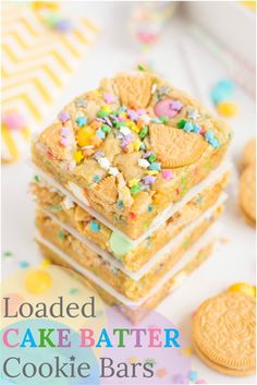 loaded cake batter cookie bars stacked on top of each other