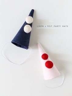 two party hats with red and white dots on them