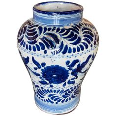 a blue and white vase is shown on a white background with an intricately designed design