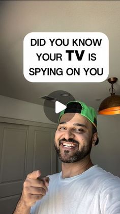 a man with a funny sign above his head that says, did you know your tv is spying on you?