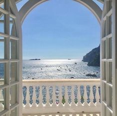 an open window looking out at the ocean