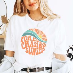 Forever Chasing Sunsets Shirt, Summer Shirt, Beach Tee, Sunset Shirt, Sunrise Shirt, Sunshine Shirt, Beachy Vibes Tee, Aesthetic Summer Tee This tee is the cutest shirt provide a fun and creative way to share the good news with friends and family, family photos and pictures. 👉HOW TO ORDER👈 1️⃣ Please review all the information provided before placing an order 2️⃣ Select the shirt type and size using the drop down menu. 3️⃣ Select the color of the shirt using the following drop down menu. 4️⃣ Need more Items? Add the current item in the cart. And If you like to add more items to your order please press the back button and repeat steps 1-3 again. 5️⃣ Once all your desired items are in your cart you may complete your order by entering your payment method, desired shipping address and click Retro Slogan Summer Tops, Retro Summer Tops With Slogan, Retro Slogan Tops For Summer, Trendy Vacation Shirt With Text Print, Trendy Text Print Vacation Shirt, Summer Shirt With Funny Print In Relaxed Fit, White Shirt With Text Print For Summer, Spring Beach Shirt With Text Print, Summer White Camp Shirt With Letter Print