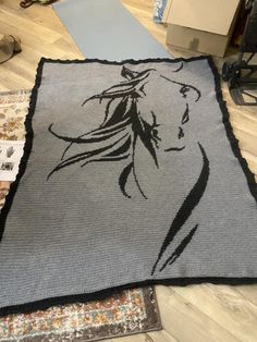 a rug with a horse drawn on it