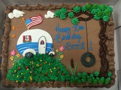 the birthday cake is decorated with an rv and flag on it's front lawn