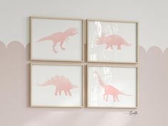 three pink dinosaur silhouettes mounted to the wall in a child's playroom