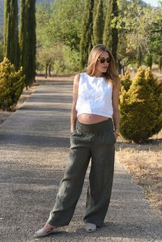 Style // The perfect dark green linen pants The must have, high-rise and wide leg linen pants. Our Rio Pants are loose fitting and feature a large elastic waistband for ultimate comfort. Flattering and stylish, and of course with side pockets too, the Rio Pants are the ideal casual and comfortable sunshine staple, and their flexible fit make them a dreamy option for paternity or postpartum pants as well. Based off the design of our best selling Isla Pants, but with a little more flexibility Fabr Green Linen Harem Pants With Elastic Waistband, Green Linen Wide Leg Pants With Elastic Waistband, High Waist Green Linen Pants, Chic Green Wide Leg Linen Pants, Green Linen Wide Leg Pants, Chic Green Linen Wide Leg Pants, High-waist Green Linen Pants, Green High-waist Linen Pants, Green Linen High-waisted Pants