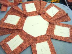 several pieces of paper are arranged in the shape of a flower with writing on them