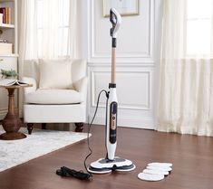 an electric steam mop is on the floor