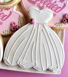 decorated cookies with wedding dress and name on them