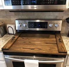 a stainless steel oven and microwave in a kitchen