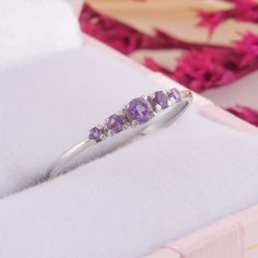 Dainty silver amethyst promise ring for her, Unique small & dainty womens promise ring, Womens amethyst silver ring, Simple silver ring WE OFFER UNLIMITED PERIOD INSTALLMENTS PLAN This is a beautiful, stunning, feminine ring that works well for all occasions, styles, and ages. You will love it! Ring information: Stones: Amethyst Approximate size: 3.0mm (1 stone) Approximate size: 2.0mm (2 stones) Approximate size: 1.75mm (2 stones) Metal type: Silver Metal stamp: 925 sterling silver Installm Purple Open Birthstone Ring, Purple Open Ring Birthstone Ring, Amethyst Birthstone Ring In White Gold, Elegant Purple Stackable Birthstone Ring, Dainty Lavender Amethyst Ring, Dainty Amethyst Ring In Lavender, Dainty Amethyst Ring With Prong Setting, Dainty Silver Topaz Promise Ring, Promise Amethyst Ring