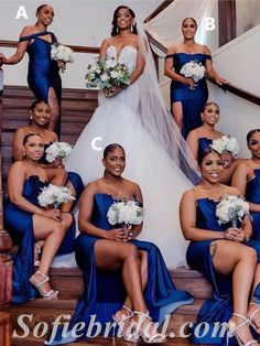 the bride and her bridal party are posing on the stairs