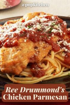 a plate of chicken parmesan with sauce on it