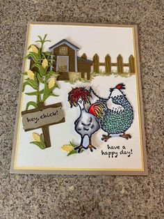 a close up of a greeting card with two chickens on the front and one chicken on the back