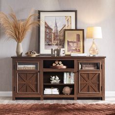 a living room with a book shelf and pictures on the wall