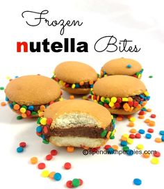 four cookies with chocolate frosting and sprinkles on them are shown in front of the words, frozen nutella bites