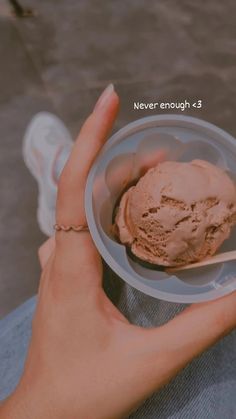 a person holding a bowl with ice cream in it and the text never enough 3