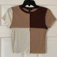 New With Tags/ Never Worn Forever 21 Brown, Tan, & Cream Patchwork/Color Block Baby Tee/ T-Shirt Cropped Length- Sits Right At The Belly Button Slim Fitting Size Small **The Dark Brown Square Is Lighter In Person. The Last 2 Photos Most Accurately Reflect The True Color Of The Shirt Belly Shirts, Forever 21 Shirts, Patchwork Shorts, Strappy Crop Top, Brown Square, Brown Babies, Light Blue Shorts, Sun Shirt, Orange T Shirts