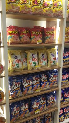 shelves filled with lots of different types of snacks