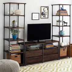 a living room with a television, bookshelf and other items on the shelves