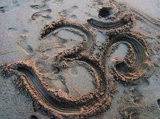 the number 50 is drawn in the sand