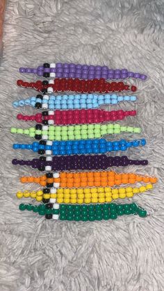 Adopt this adorable little worm buddy! Perfect for raves, gifting, and even stocking stuffers! Rave Candy Bracelets, Kandi Worm, Bead Pattern Ideas, Kandi Kidcore, Kandi Singles Ideas, Kandi Keychain, Beady Buddies, Pony Bead Jewelry, Scene Kandi