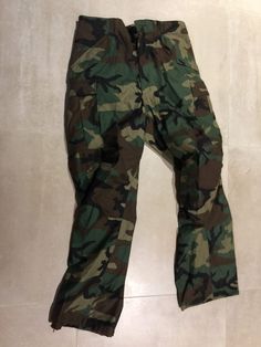 "new old stock m65 woodland pants, made in 1985 by quality apparel manufacturing company.(others can be  a different year or maker but all gi issued garments).called on label trousers, cold weather, 50% nylon 50% cotton.class 2 woodland camoflage.DLA100-85-C-0346.size is small regular  waist 27-31\", inseam 29.5- 32.5\",stock no 8415-01-099-7855 nato size 7583/6979.zipper is brass talon(can be other zipper but always brass us made famous brand)" Apparel Manufacturing, East Hampton, Medium Long, Famous Brands, Cold Weather, Art Collection, Trousers, Zipper, Trending Outfits