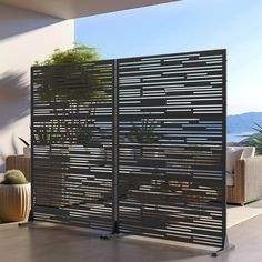 a room divider made out of metal slats with plants in the corner on top