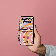 a person holding up a birthday party phone case in front of a pink background with flowers