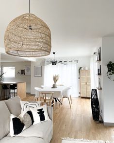 a living room filled with furniture and a white table