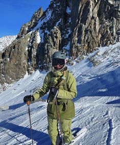 a person on skis standing in the snow