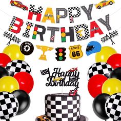 a birthday party with balloons, cake and race cars on the table in front of it