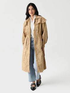 DESCRIPTION:An embroidered laise cotton trench coat made featuring a feminine silhouette with puff sleeves and scalloped trims.FEATURES:Spread CollarShoulder OverlayPuff SleevesSide PocketsButton-Down FrontSelf-Tie BeltScalloped TrimsEmbroidered Laise DesignLong Silhouette100% CottonRelaxed FitModel is wearing size Small coat.Model's Measurements: Height: 5'8" | Bust: 32B | Waist: 25" | Hips: 36.5" | Dress Size: 2 (US) Fall Ruffled Outerwear For Daywear, Fall Daywear Outerwear With Ruffles, Embroidered Fall Outerwear For Daywear, Embroidered Outerwear For Fall Daywear, Embroidered Outerwear For Daywear In Fall, Khaki Trench, Khaki Trench Coat, Denim Sweater, Feminine Silhouette