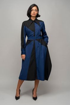 Navy blue and black full sleeves shirt dress with a composition color block pattern and front placket highlighting the asymmetrical side hem of the garment. Comes with a matching buckle belt. - Aza Fashions Designer Long Sleeve Dresses For Workwear, Long Sleeve Patchwork Dresses For Office, Long Sleeve Patchwork Office Dress, Modern Long Sleeve Shirt Dress For Work, Long Sleeve Blue Shirt Dress For Work, Blue Long Sleeve Shirt Dress For Work, Office Blue Midi Length Shirt Dress, Black Shirt Dress With Belted Cuffs For Workwear, Black Belted Cuffs Shirt Dress For Work