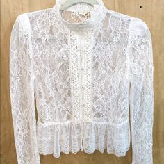 Gorgeous White Lace Blouse With Mock Neck, Button Details, And A Peplum Accent Fits True To Size Fall Lace Top With Button Closure, Fitted Lace Button-up Top, Long Sleeve Lace Tops With Button Closure, Feminine Lace Button-up Top, Feminine Lace Top With Button-up Design, White Lace Tops With Button Closure, Feminine Lace Tops With Buttons, Blouse Lace, White Lace Blouse